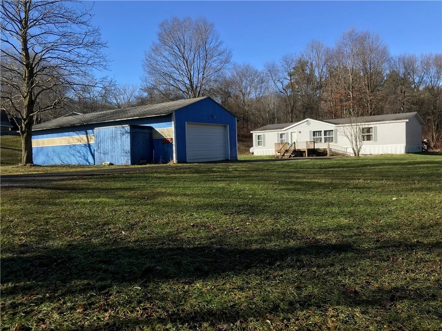 Exterior front view of house and garage