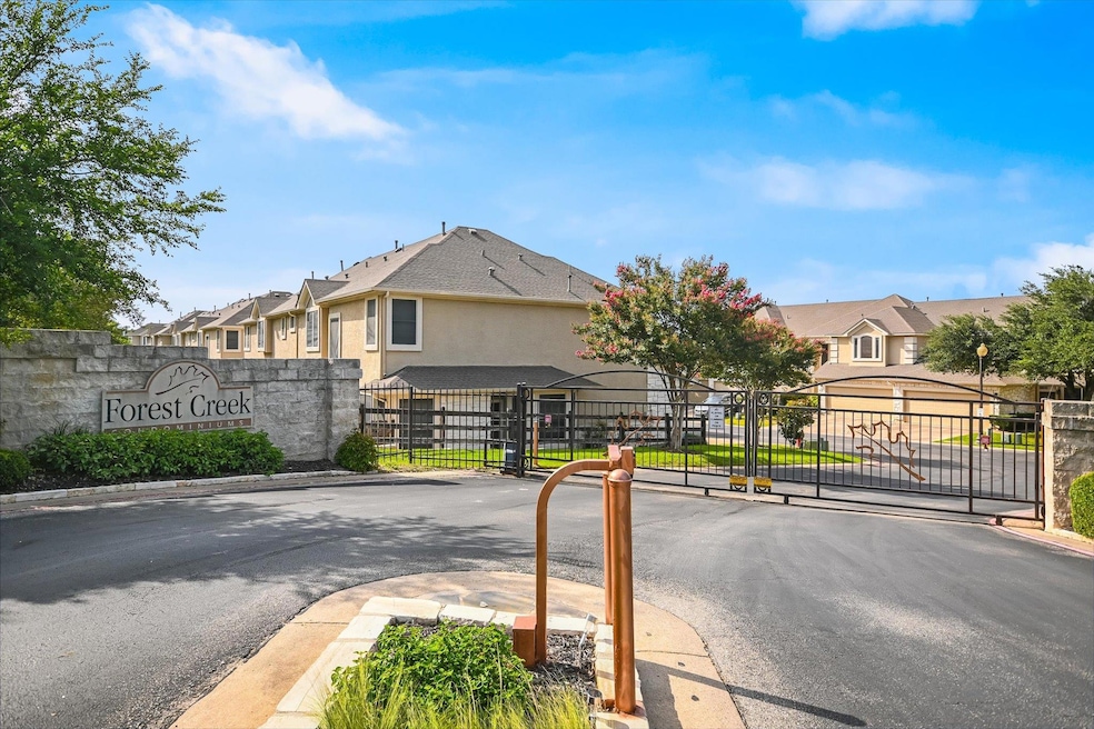 View of asphalt road featuring a residential view