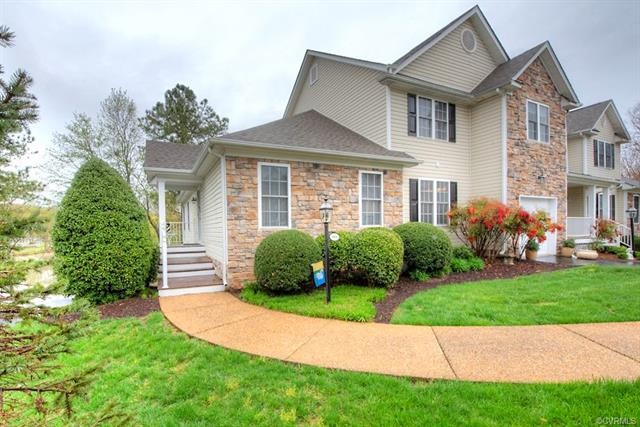 Exterior Stone Front with Aggregate Walkway