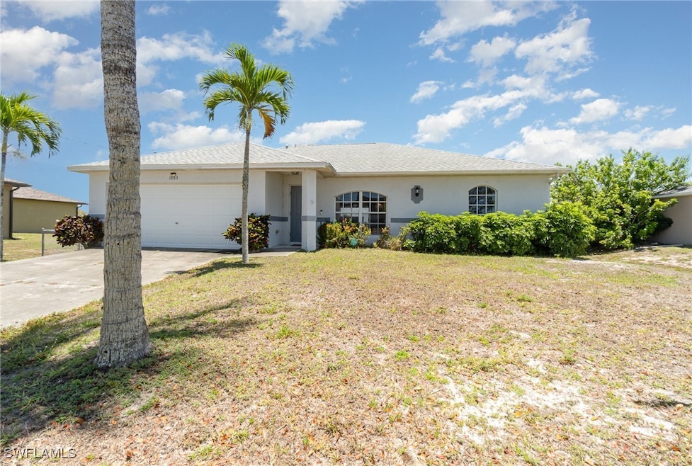 Single story home with concrete driveway, a garage