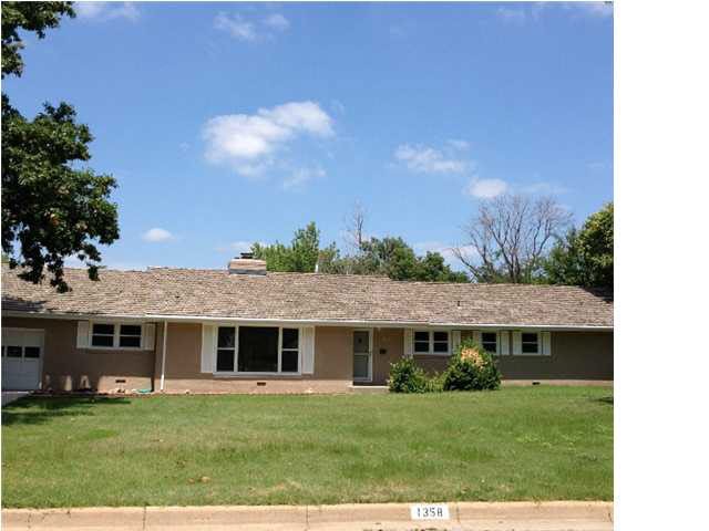 Front elevation of this large ranch home on a shor