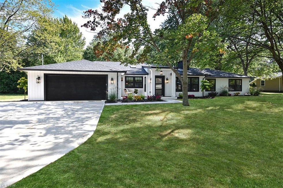 View of front facade featuring garage and a front 