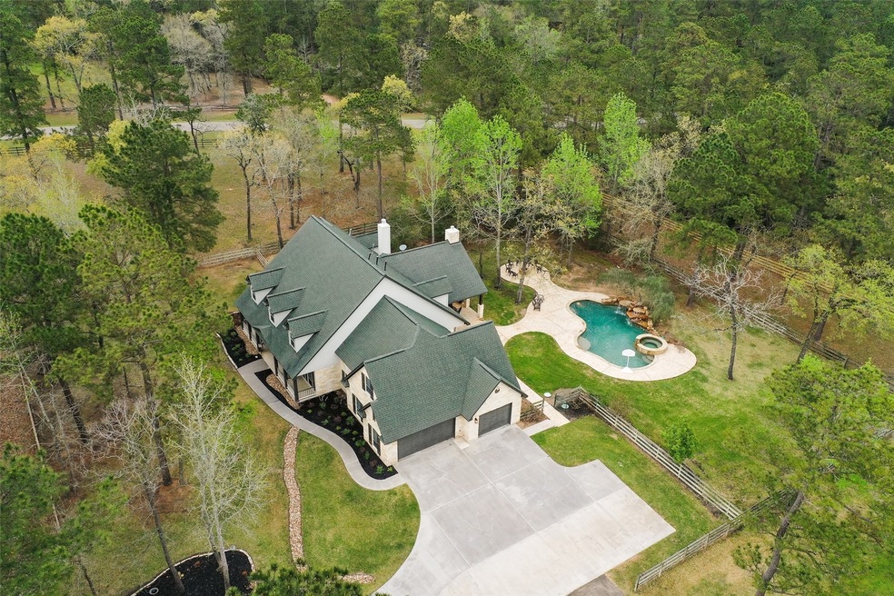 Approximately 5.09 acres Cross fenced for horses! 3 car Garage, Pool, Spa and Waterfalls plus separate firepit area and FABULOUS Outdoor Kitchen area! Water Well for irrigation and Pool!! Minimum 4 stall barn , but could have more. Plus Tack Room and Workshop area! All in HIGH MEADOW RANCH close to the Golf Course!