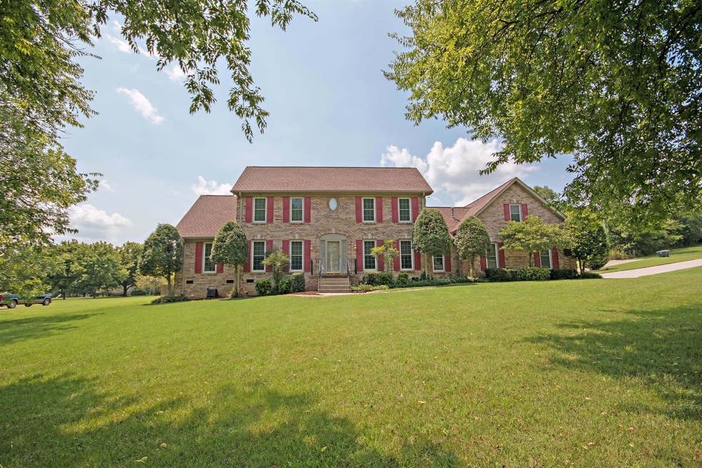 Come tour this massive traditional style home.  Beaautiful large corner lot that is nearly an acre. 