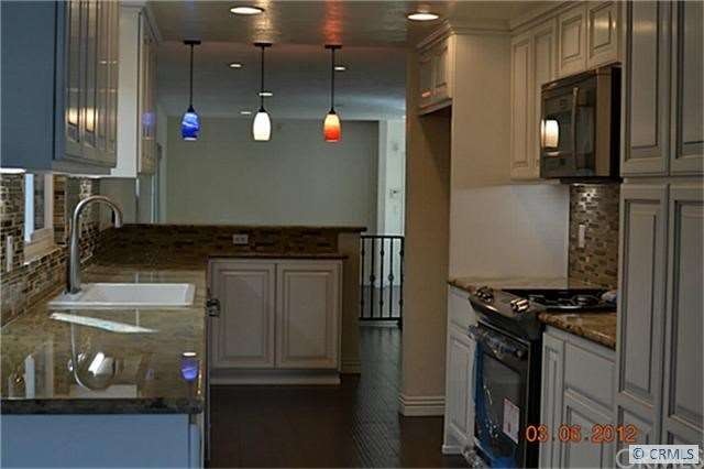 Bright kitchen with new stainless steel appliances