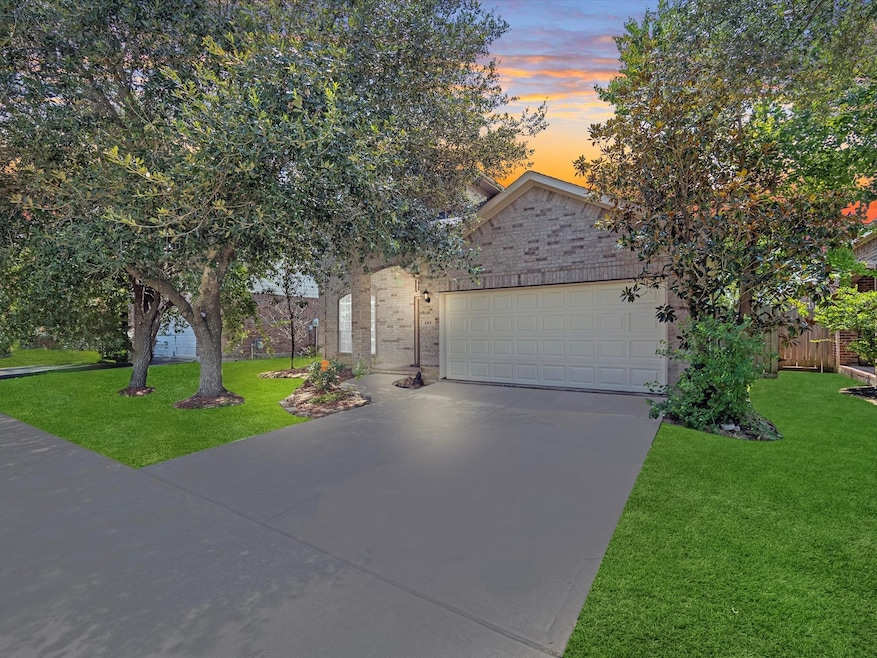 Charming single-story home featuring a two-car gar