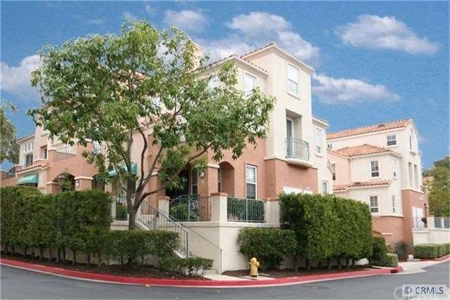 Turnkey tri-level carriage townhome available at a