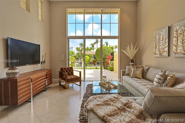 Relaxing family room overlooks the private patio a