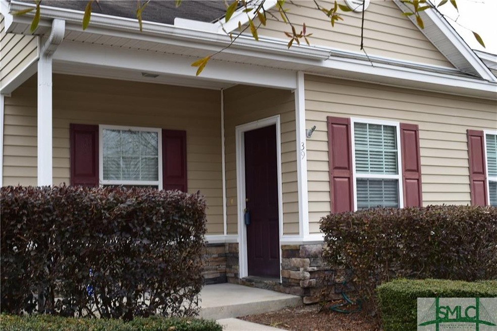 Front view of home.  Porch large enough for a rock