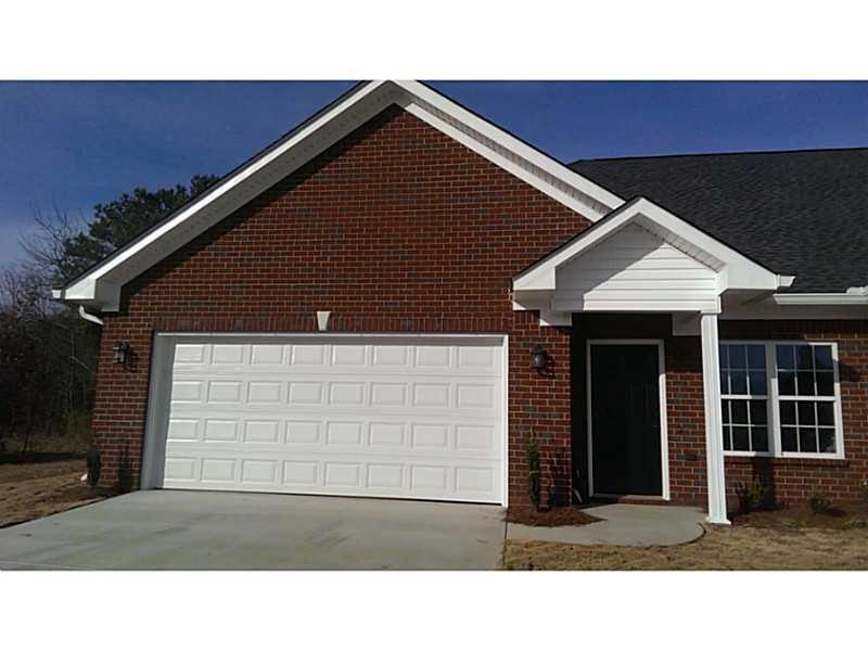 Exterior Front. This gracious end unit garden home