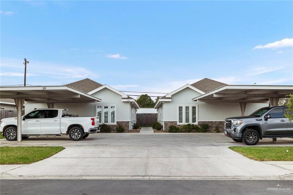 Ranch-style house featuring stone siding, covered parking, stucco siding, and fence