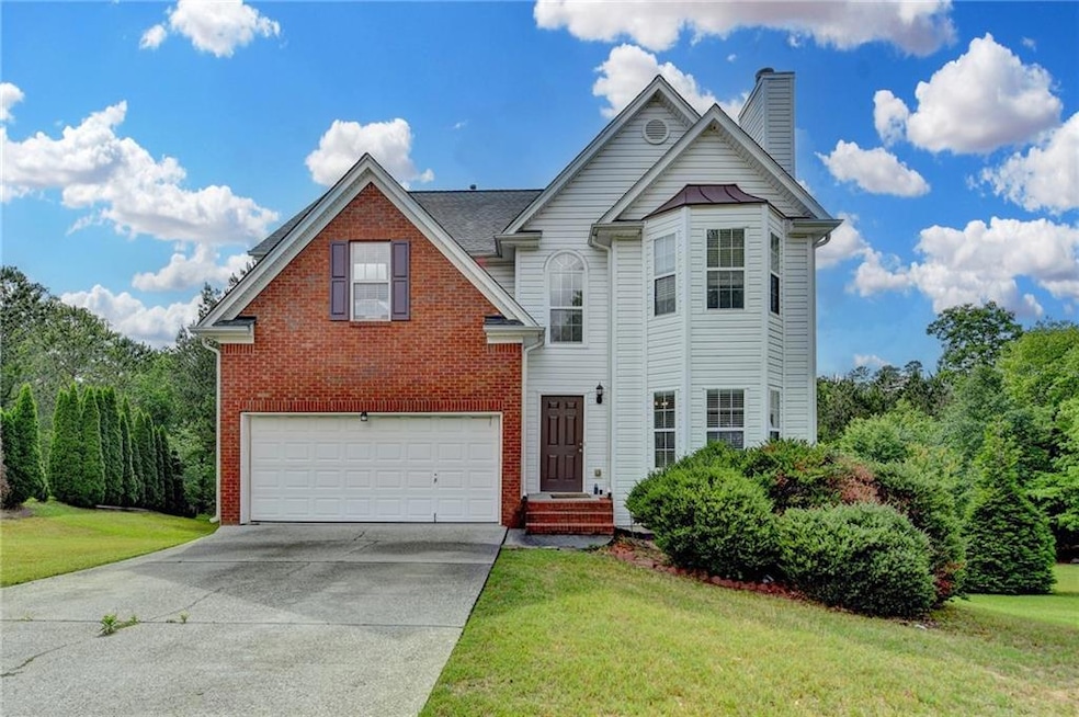 View of front of property with an attached garage,