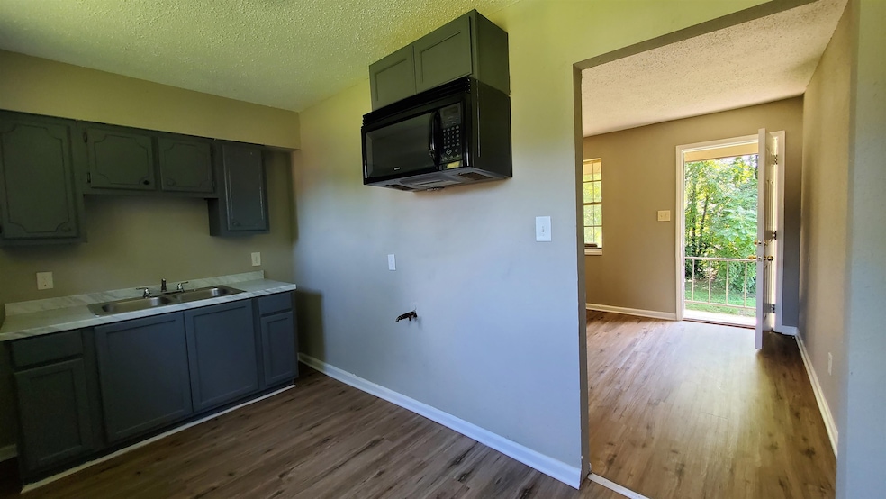 2BR, 1 Bath Renovated, New Floors, Paint and Kitchen Cabinets.