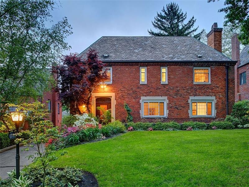 Large brick home in an English Manor style , locat