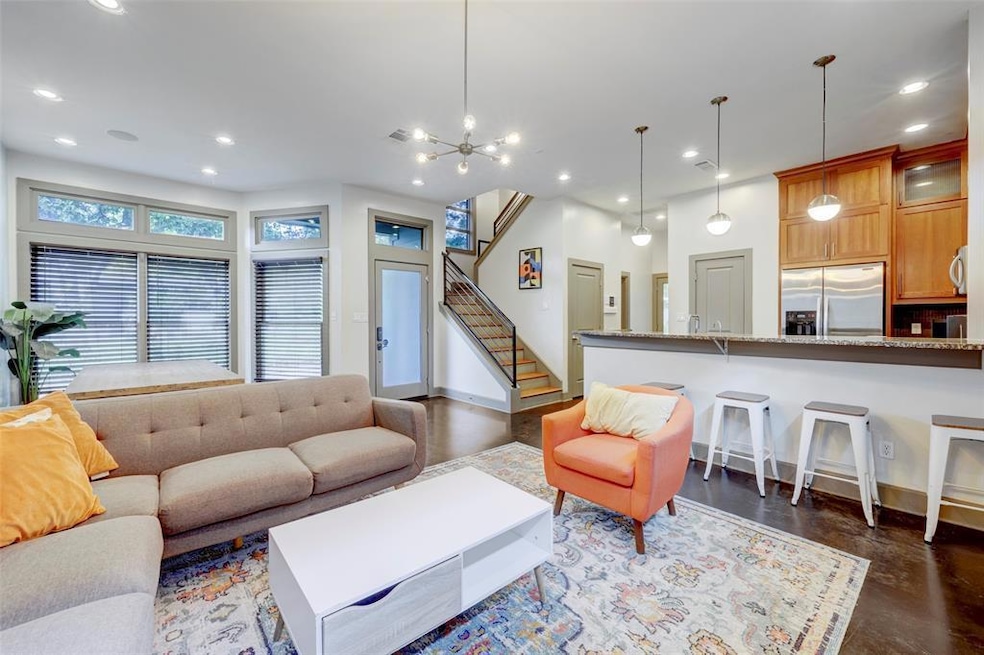 Living area with baseboards, an inviting chandeli