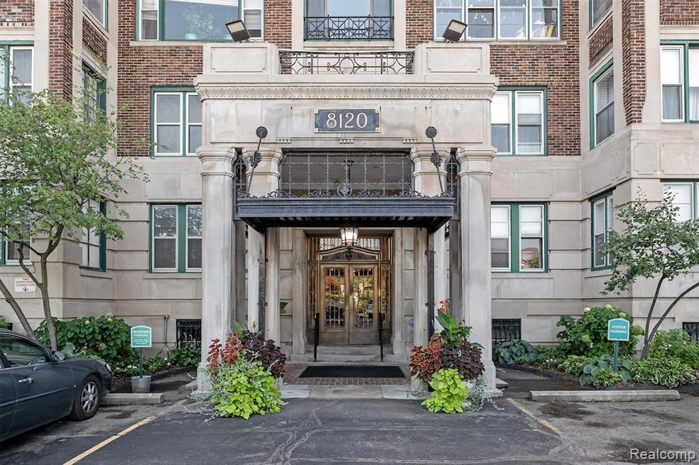 Entrance to property featuring uncovered parking, stone siding, and french doors