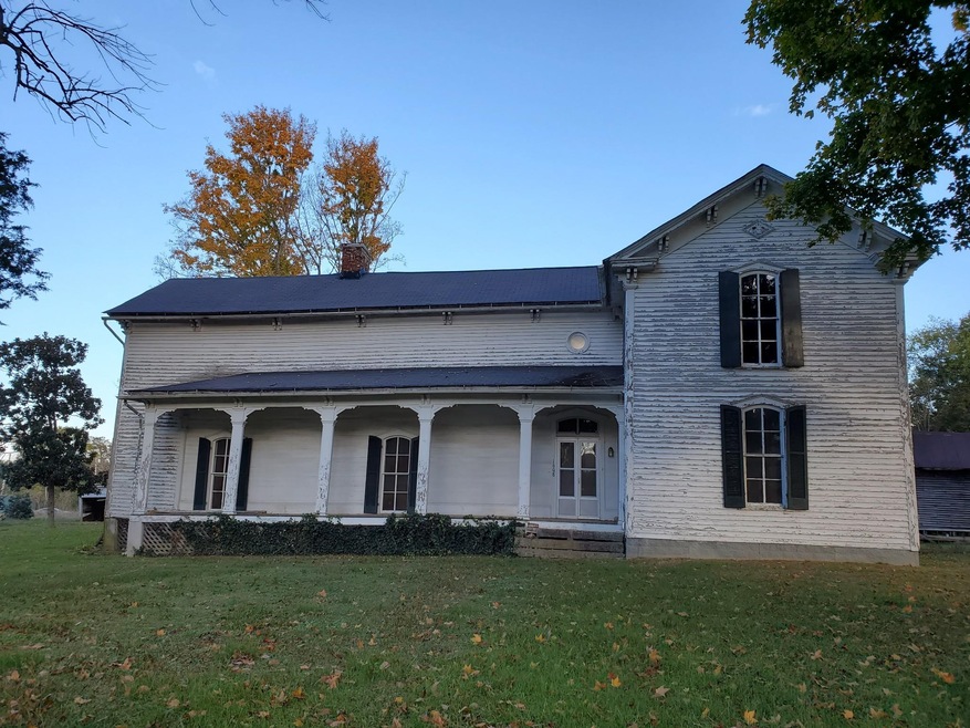 Welcome Home to this Historic House with Large Covered Front Porch in Belfast, TN. 