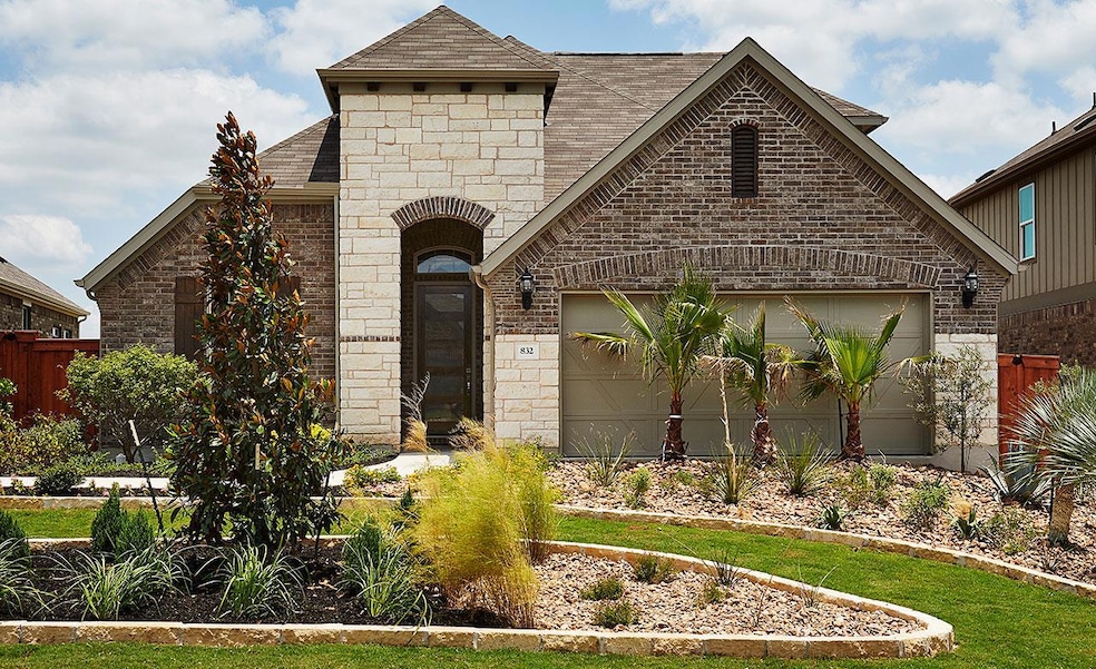 French country inspired facade featuring an attac