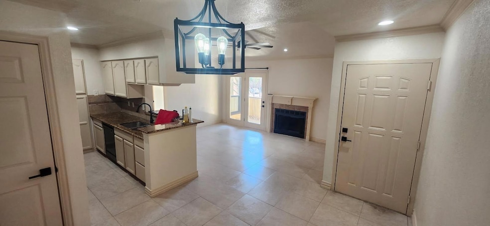 Kitchen with recessed lighting, a fireplace, a sin