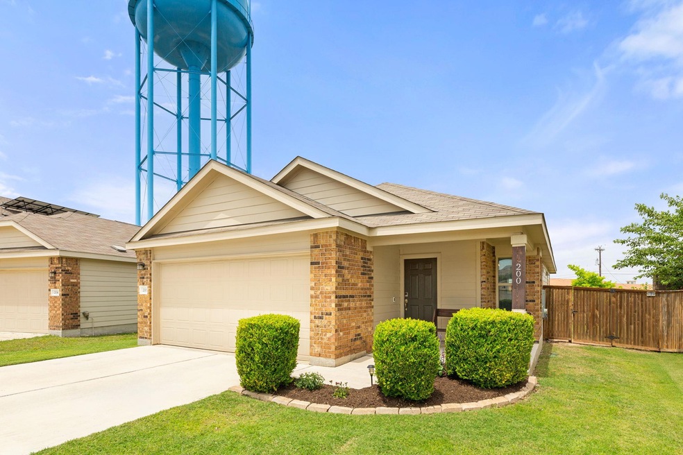 View of front of house featuring brick siding, an