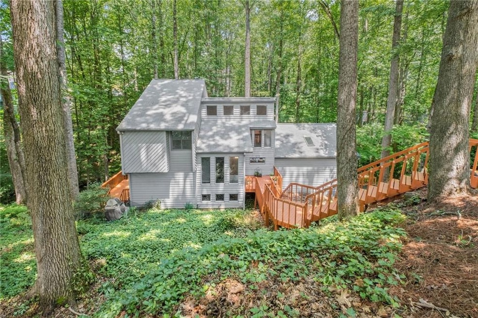 Escape to your very own private wooded home with the feel of the mountains yet just minutes to the convenience of bustling East Cobb