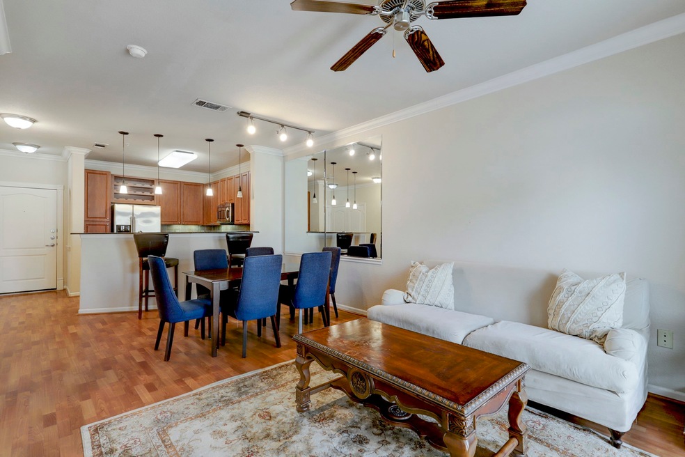 This open-concept living space features laminate f