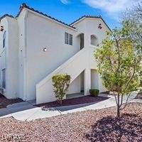 Back of house with stucco siding