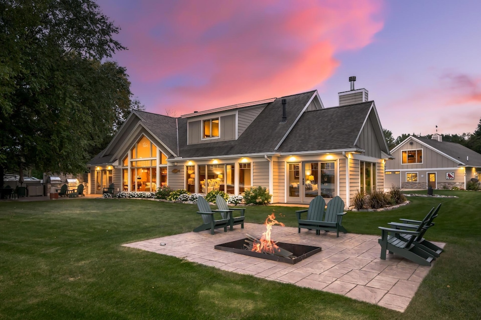 This stunning and unique three-bedroom, three-bathroom home is a rare opportunity on German Lake, offering 5.4 acres of private land and 135 feet of sandy shoreline.