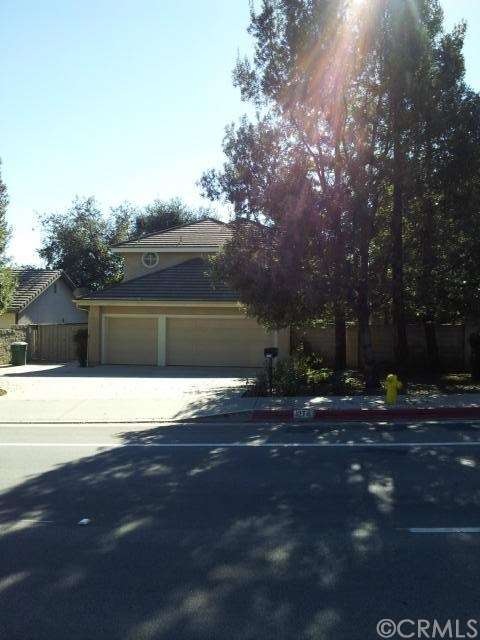 Front view of home with private entry to the left