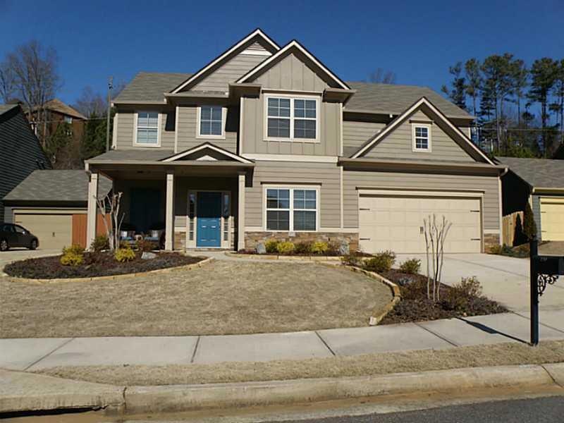 Exterior Front. Concrete siding and trim  painted 