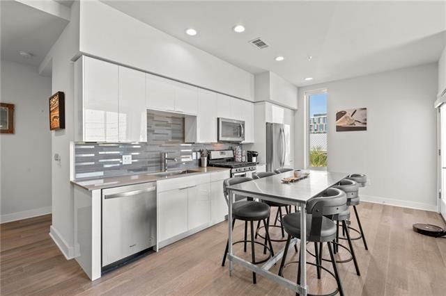 Spacious kitchen, opens up into living room.