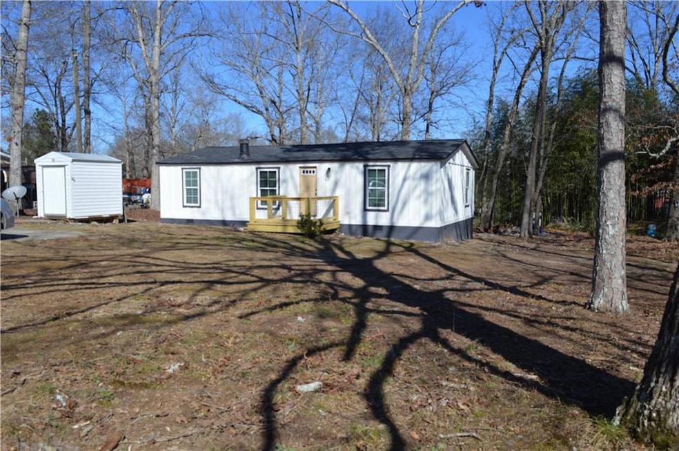 View of front facade with a storage shed