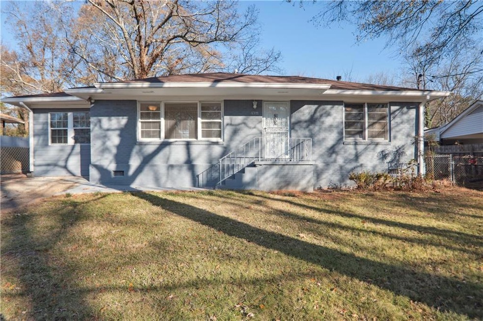Ranch-style home with front yard