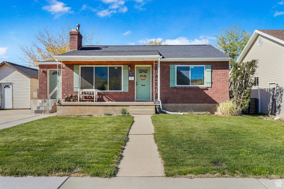 Bungalow-style home with brick siding, a chimney, and a shingled roof