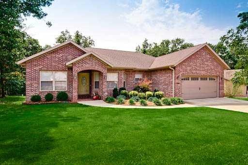 Exterior Front. CUSTOM BUILT ONE OWNER HOME