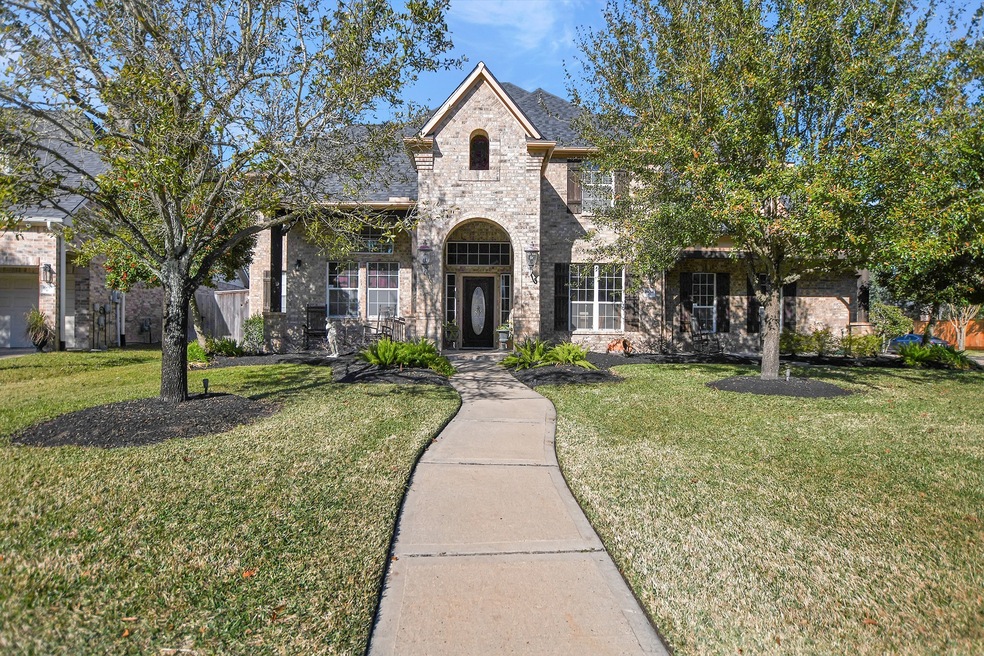Front of house features two sitting patio areas