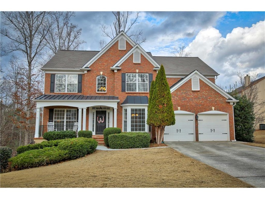 Beautiful brick home with rocking chair front porc