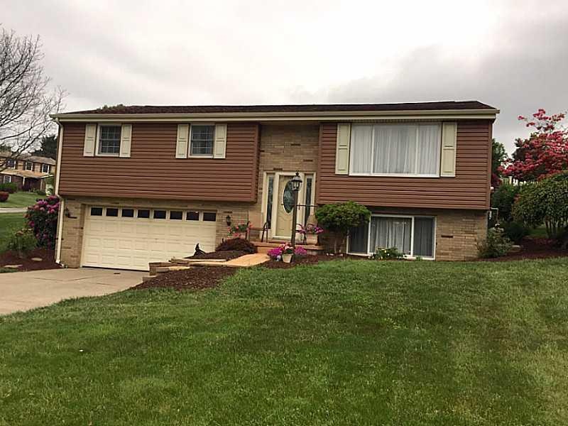 Exterior Front. Level front yard, level concrete d
