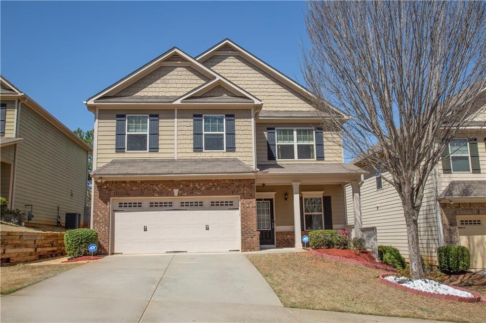 Craftsman-style house with an attached garage, sid