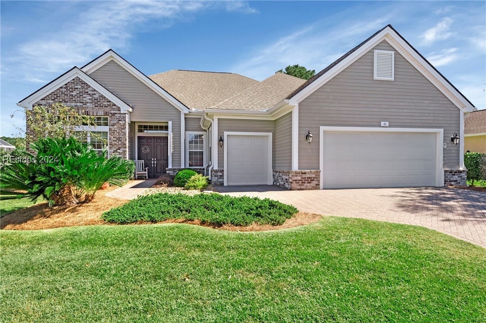 View of front of property featuring a front lawn a