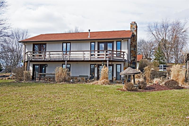 Welcome to this unique 2 story home on .67 acres i