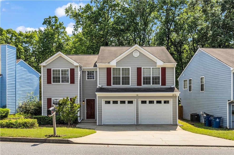 Traditional home with driveway, central air condit
