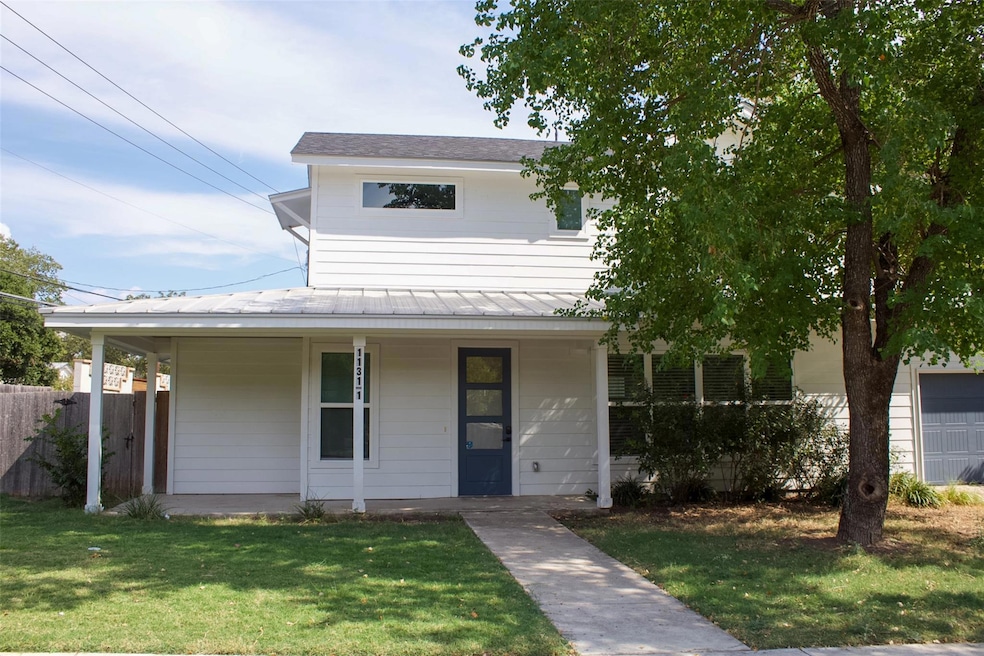 View of front of home featuring a porch and a fro