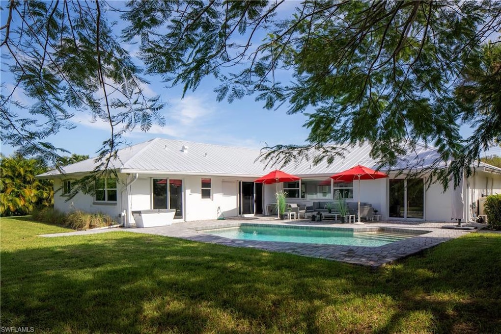 Back of house featuring a yard and a patio area