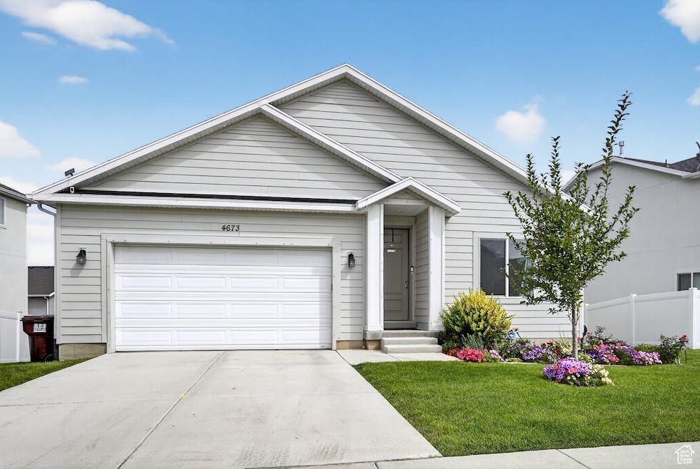 Ranch-style home featuring driveway and a garage