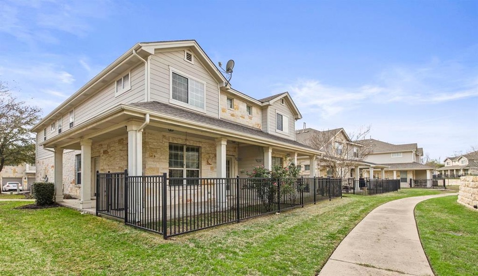 Right side of the building with gated yard.