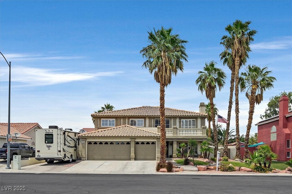 View of front facade with an attached garage, a ti