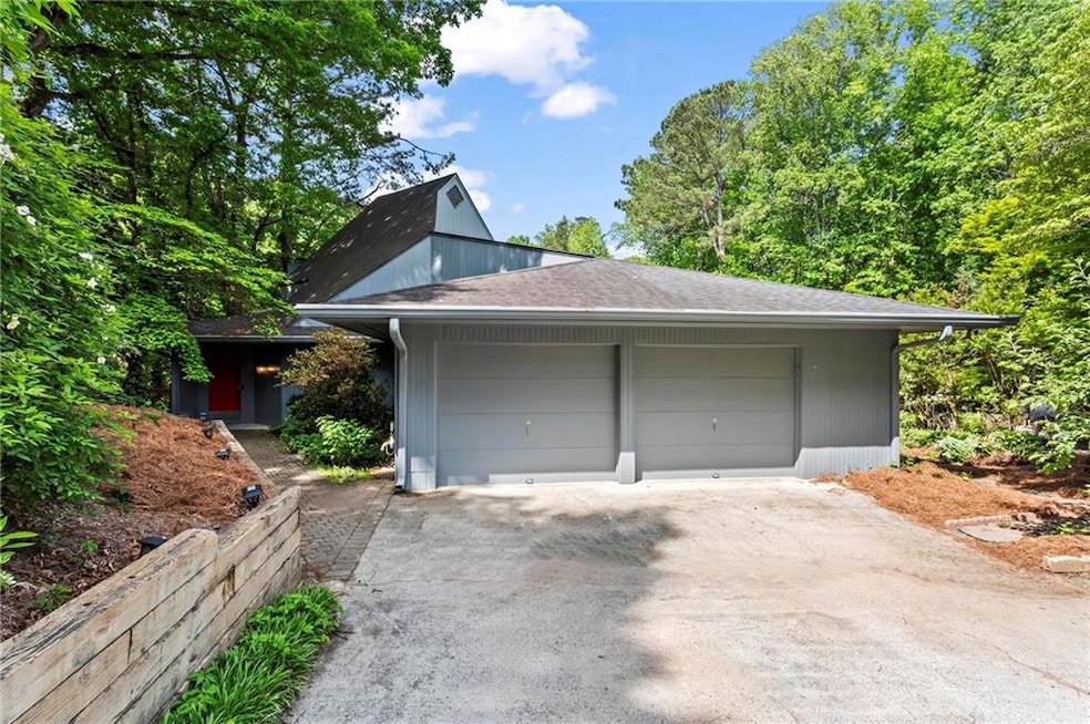 Contemporary home overlooking a pond, also in Loch Highland community with a 31 acre lake