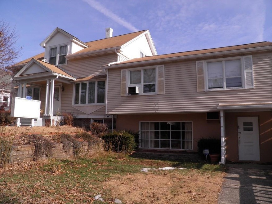 VIEW FROM MAPLE STREET. TWO FAMILY HOME WITH THE L