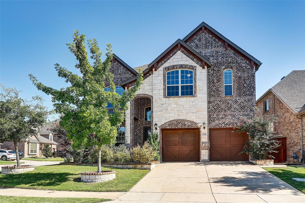 View of front of home featuring a garage and a fro
